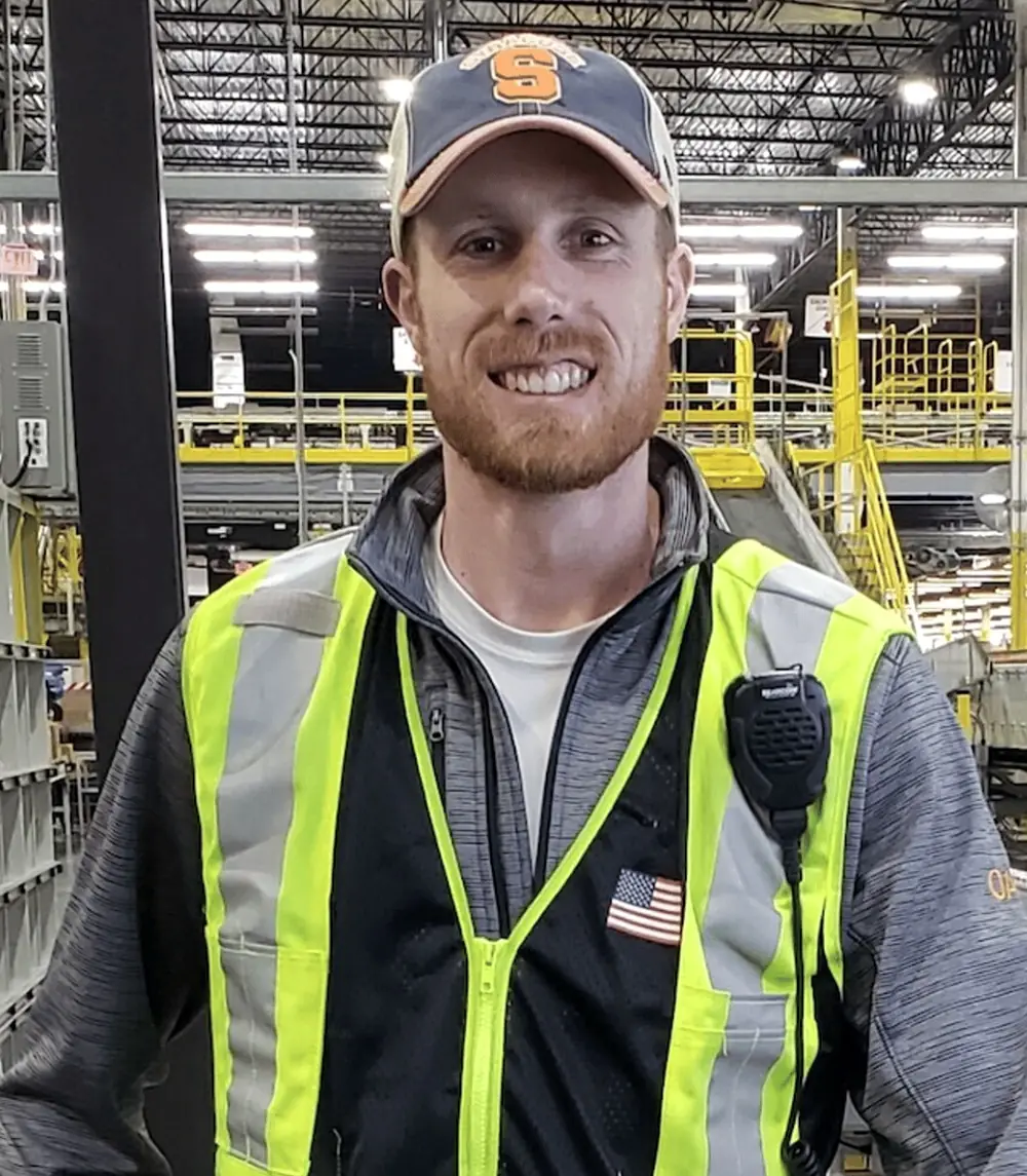Ben Williams on the floor of a distribution center
